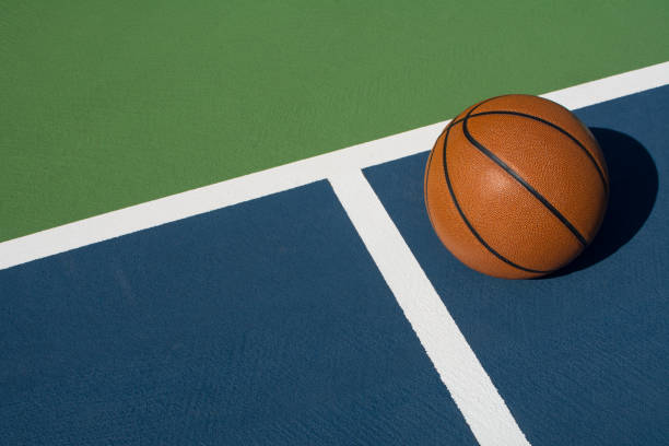 istock Basketball rests on court 1062495684