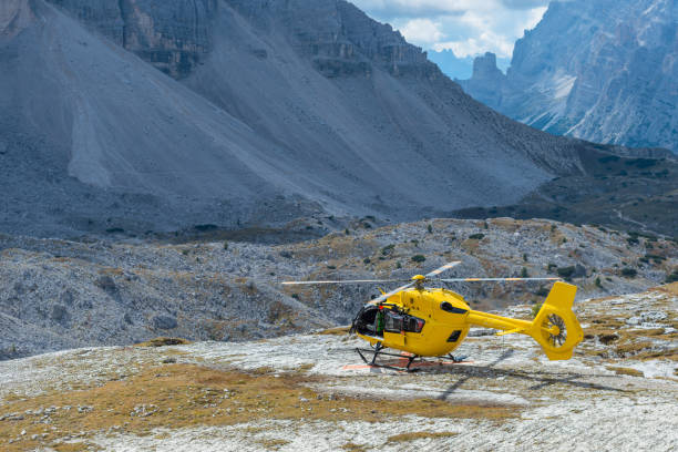 istock Yellow helicopter in the mountains, Dolomites, Italy 1062499120