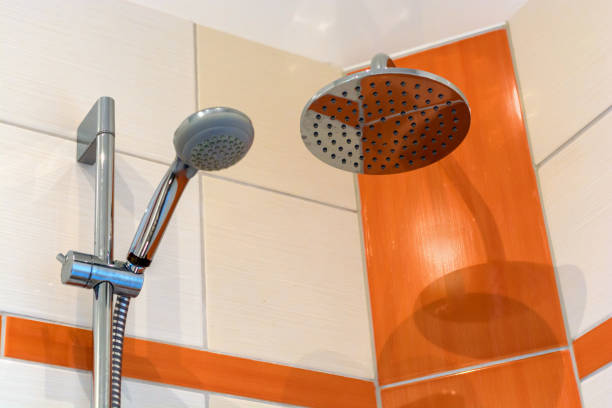 istock Shower with two shower heads and modern tile mirror 1062501568