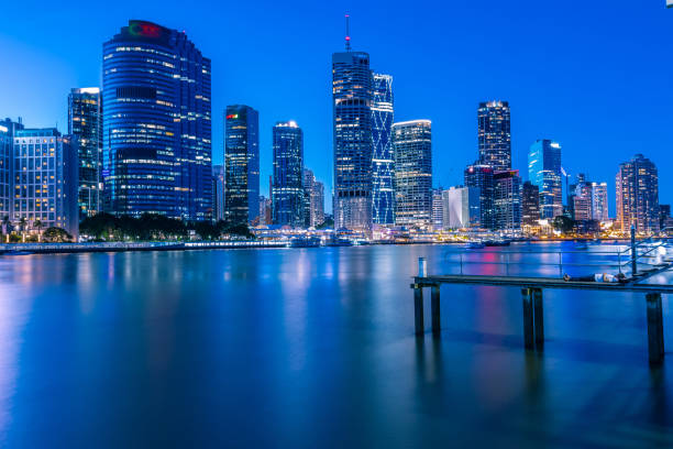 istock Human laying on pier and city's skyline behind 1062504470