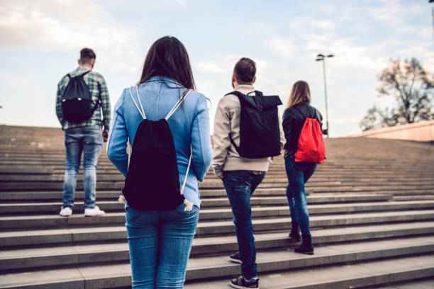 istock Rear View Of Student Colleagues On Stairs 1062514584