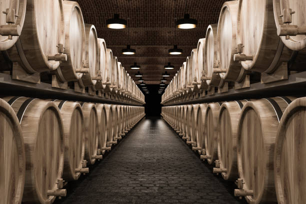 istock Rows of wine or beer kegs with taps, brick cellar 1062516152