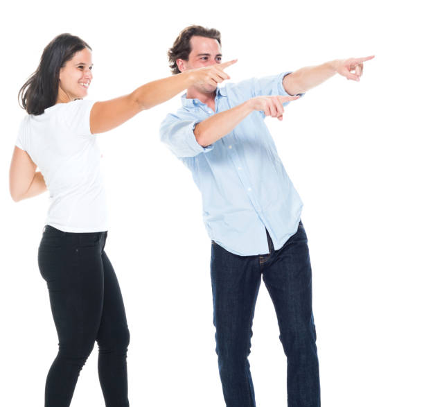 istock Attractive couple are pointing ot the side 1062516904