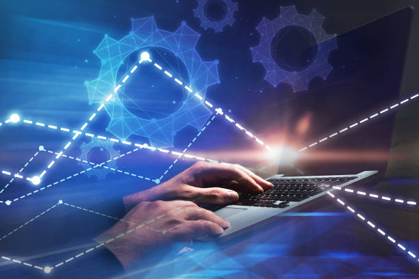 istock Man hands typing on laptop, cogwheels and graphs 1062517030