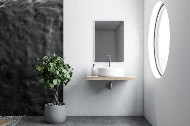 istock Tile and crude gray wall bathroom, white sink 1062517276