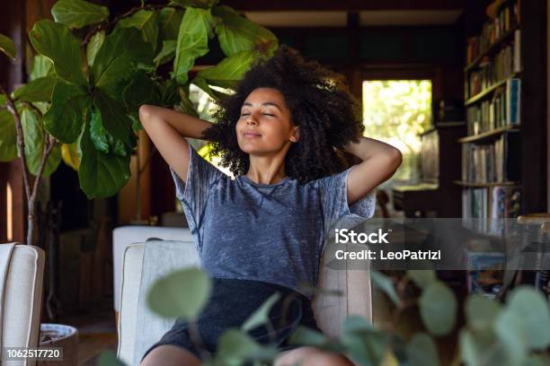 Young Woman Spending A Relaxing Day In Her Beautiful Home Stock Photo - Download Image Now