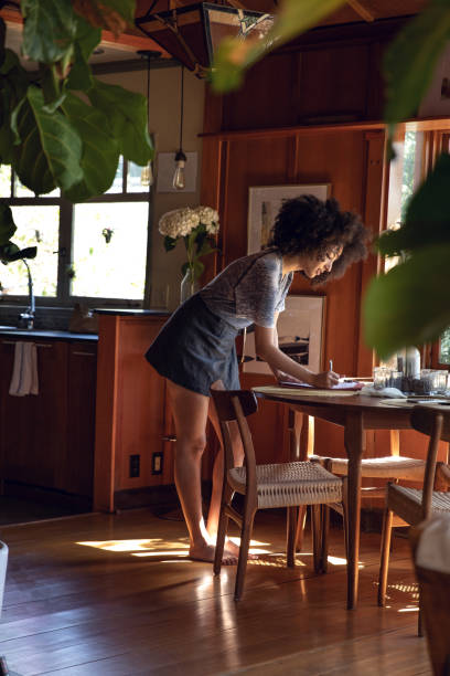 istock Young woman spending a relaxing day in her beautiful home 1062517846
