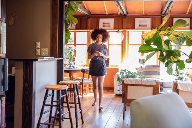istock Young woman spending a relaxing day in her beautiful home 1062518006