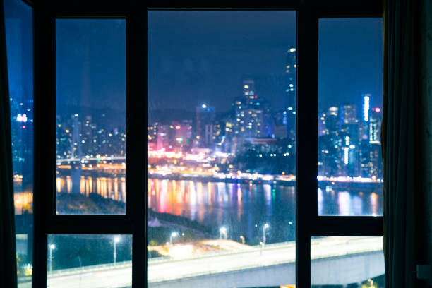 istock Glass window with city night 1062519960