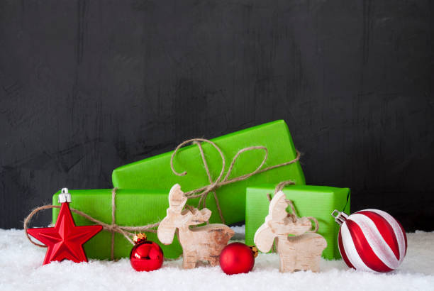 istock Green Christmas Gifts, Snow, Copy Space, Black Background 1062521896