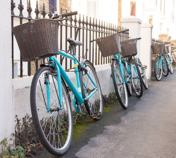 istock Row of matching rental student bicycles with baskets 1062537004