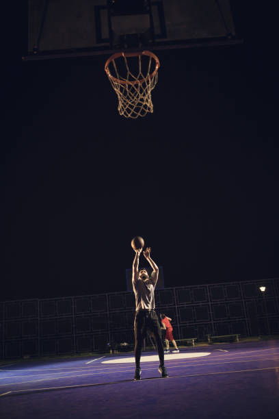 istock Young bearded men playing basketball outdoors 1062546592