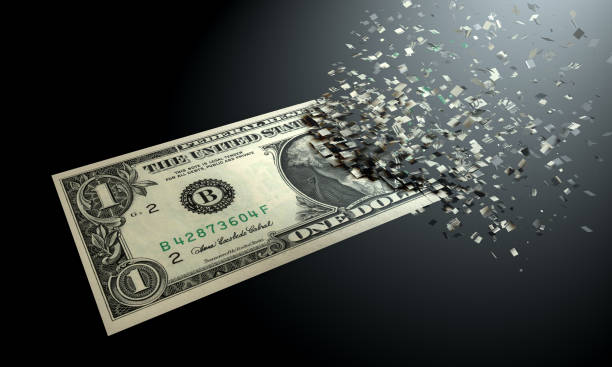 istock The dematerialization of money, dollars are dematerialized on a black background. 1062547002