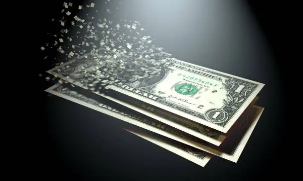The dematerialization of money, dollars are dematerialized on a black background.