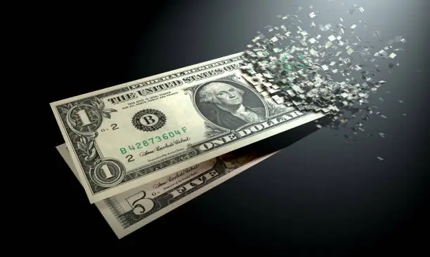 Photo of The dematerialization of money, dollars are dematerialized on a black background.