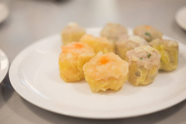 istock Chinese steamed dumpling on white plate. 1062549288