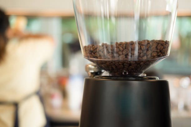 istock Coffee beans in the coffee grinder at coffee shop 1062549390