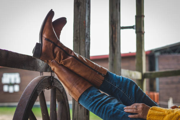 istock Woman wearing leather boots and denim jeans 1062558028