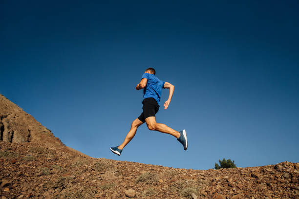 istock athlete runner running uphill mountain trail 1062562288