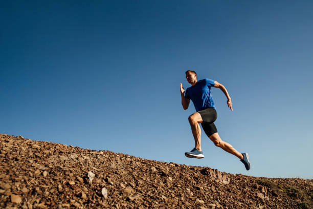 istock dynamic running uphill athlete runner on background of blue sky 1062562300