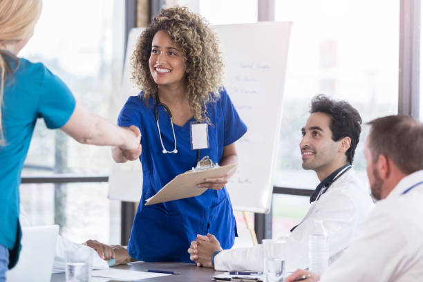 istock Young doctor prepares to give presentation during meeting 1062564322