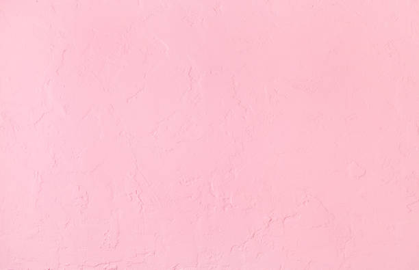 istock Texture of plastered concrete pink background 1062564610
