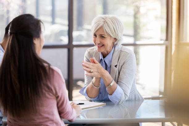 istock Cheerful counselor works with married couple 1062564618