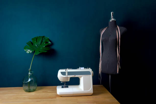istock Sewing room decorated with monstera leaf and black dress dummy 1062565556