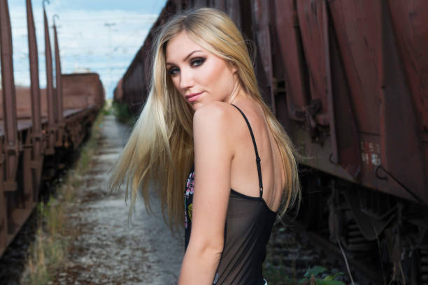 istock Girl on rail tracks 1062566772
