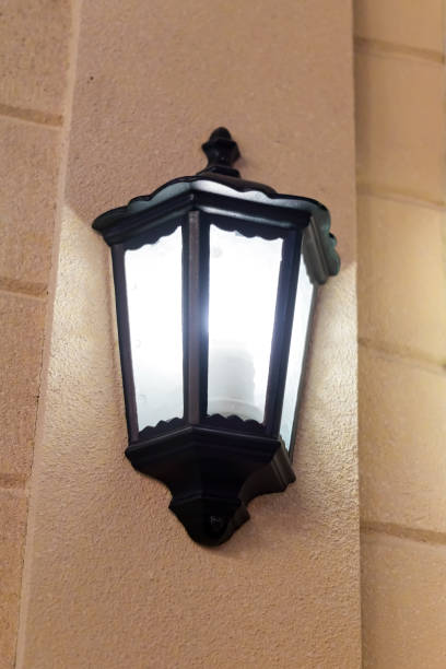 istock Black old style street lantern on the wall 1062570116