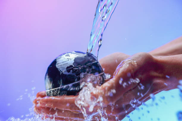 istock Water pouring on planet earth 1062571128