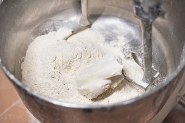 istock Close up of dough in electric bakery mixer 1062575290