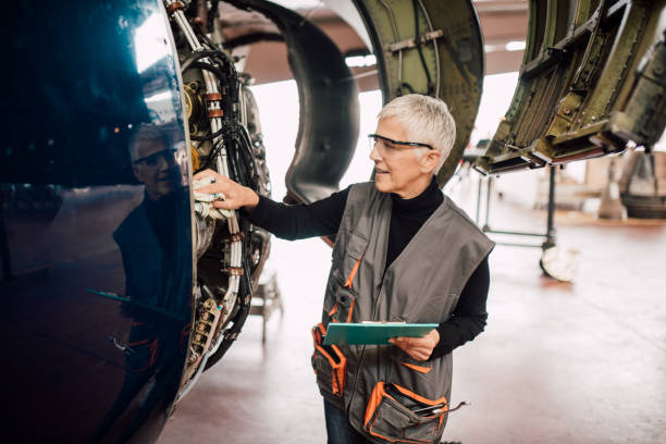 istock Senior woman examining aircraft 1062576518