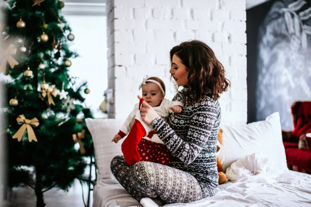 istock Mother on a bed with daughter 1062577992