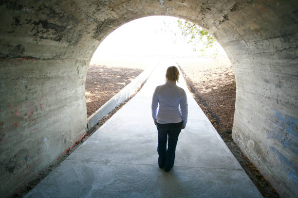 istock Woman in cement tunnel. 1062580514