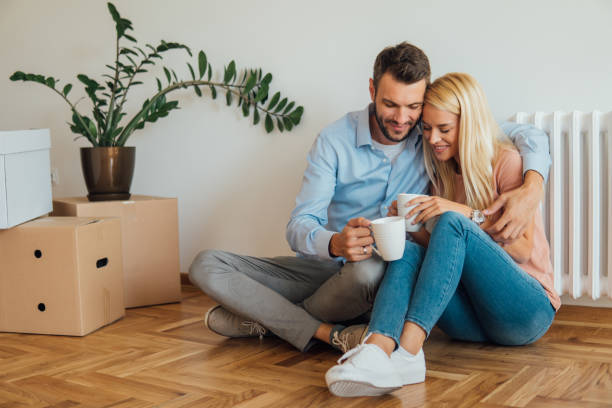istock Couple hugging when drinking coffee at new apartment 1062580932