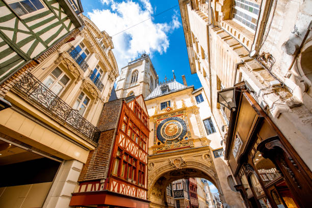 Great Clock in Rouen city, France Street view with famous Great Clock astronomical clock in Rouen, the capital of Normandy region in France rue du gros horloge photos stock pictures, royalty-free photos & images