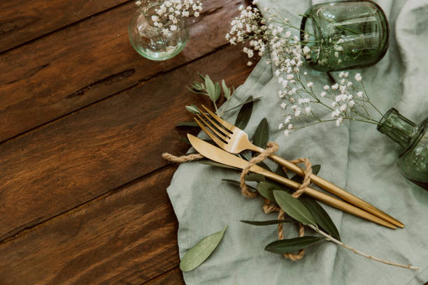 istock Rustic wedding table decorations on wooden table. Top view. Bohemian wedding tableware. Flat lay 1062589768