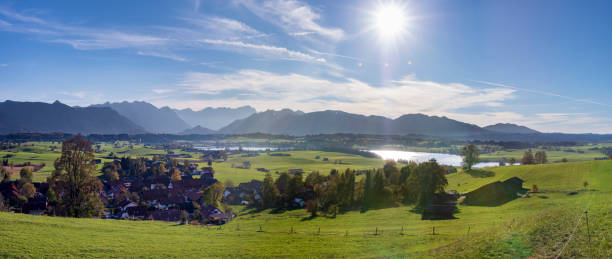 istock panoramic scene at Bavarian alps mountain range and lake Riegsee 1062592288