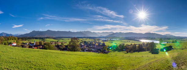 istock panoramic scene at Bavarian alps mountain range and lake Riegsee 1062594002