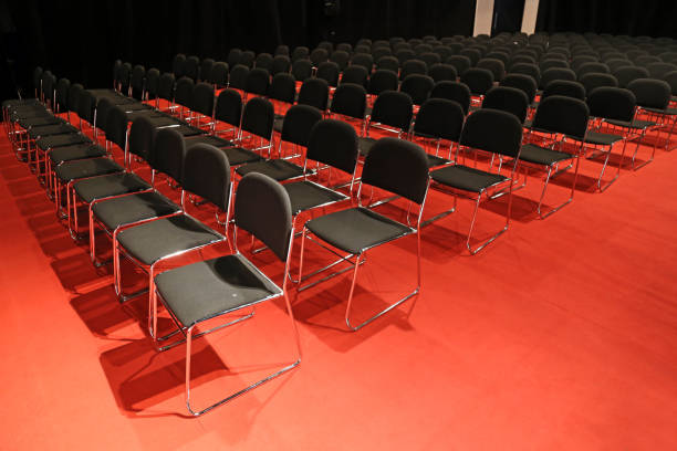 istock Free chairs in row in an empty auditorium 1062596564