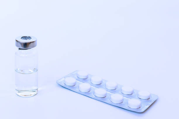 istock Vial and tablets in blister toned blue with copy space 1062601732