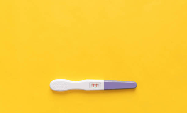 istock Pregnancy test on a yellow background. Close-up. 1062604568