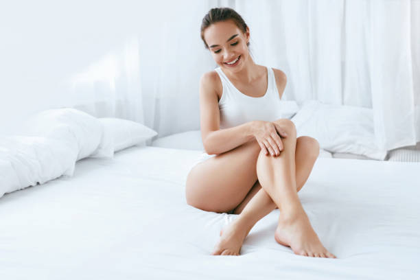 Body Care. Beautiful Woman With Smooth Soft Skin On Long Legs stock photo