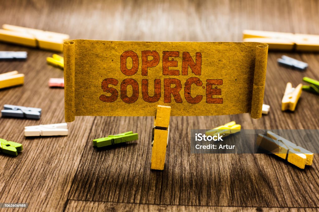 Word writing text Open Source. Business concept for denoting software which original source code freely available Clothespin holding old piece fabric several clothespins wooden floor. Word writing text Open Source. Business concept for denoting software which original source code freely available Clothespin holding old piece fabric several clothespins wooden floor Computer Software Stock Photo