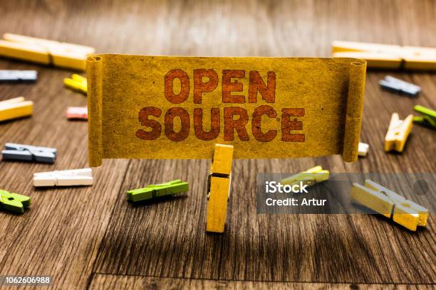 Word Writing Text Open Source Business Concept For Denoting Software Which Original Source Code Freely Available Clothespin Holding Old Piece Fabric Several Clothespins Wooden Floor Stock Photo - Download Image Now