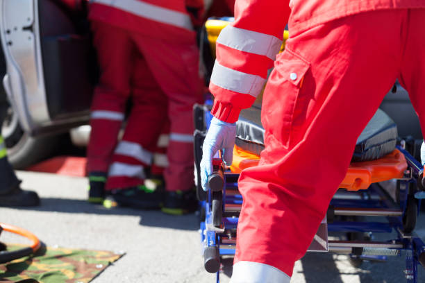 Paramedics in a rescue operation after road traffic accident stock photo