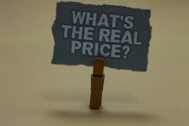 istock Handwriting text writing What s is The Real Price question. Concept meaning Give actual value of property or business Paperclip retain ash color written torn thick page on shadow ash floor. 1062609714