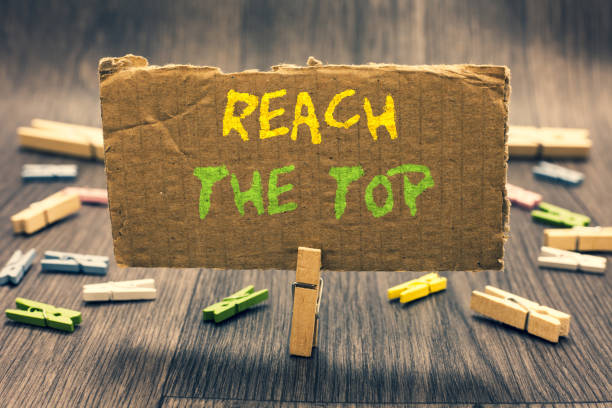 istock Writing note showing Reach The Top. Business photo showcasing Get Ahead Succeed Prosper Thrive for the Win Victory Clothespin holding paperboard important communicating message ideas. 1062610014