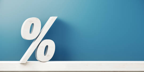 istock Percentage Sign In Front Of Blue Wall 1062621726